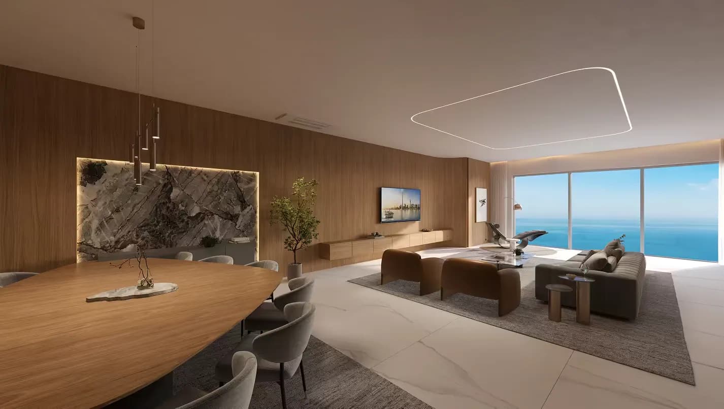 Living integrado de apartamento do Senna Tower com mesa de jantar em mármore e vista para o mar